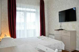 Ένα ή περισσότερα κρεβάτια σε δωμάτιο στο Natalex MicroLofts