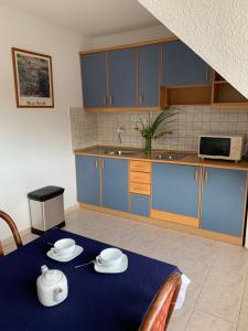 A kitchen or kitchenette at Lilium Villa Hévíz
