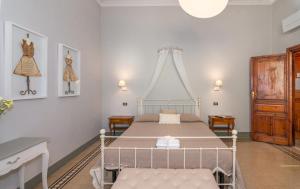 Postel nebo postele na pokoji v ubytování Villa Ricci Suites