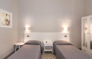 Postel nebo postele na pokoji v ubytování Villa Ricci Suites