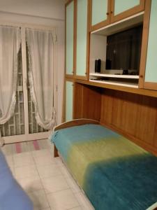 A bed or beds in a room at Casa Pavone