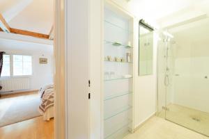 a bathroom with a walk in shower and a glass door at Schloss Schönau in Schönau an der Triesting +83 photos