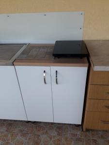 a white desk with a laptop on top of it at Apartman" Ruža" in Višegrad