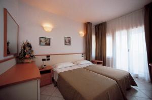 Postel nebo postele na pokoji v ubytování Hotel degli Ulivi