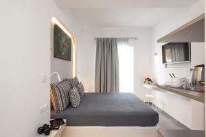 A bed or beds in a room at Mina Studios