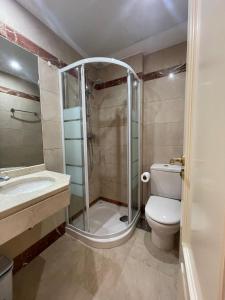 a bathroom with a shower and a toilet and a sink at Mijas,Calanova grand Golf in La Cala de Mijas