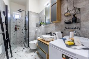 a bathroom with a shower and a toilet and a sink at Sylvia suite@Kantrida in Rijeka +52 photos
