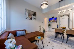 a living room with a couch and a table at Sylvia suite@Kantrida in Rijeka