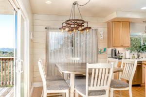 a dining room with a table and chairs at Hilltop Heaven in Atascadero