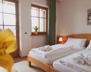Ένα ή περισσότερα κρεβάτια σε δωμάτιο στο Hotel Corno Bianco