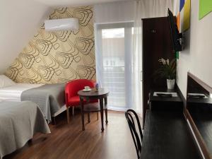 Posteľ alebo postele v izbe v ubytovaní Apartamenty i Pokoje Na Letniej