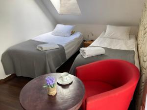 Posteľ alebo postele v izbe v ubytovaní Apartamenty i Pokoje Na Letniej