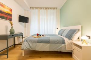 A bed or beds in a room at Italianflat - Vittoria Suite