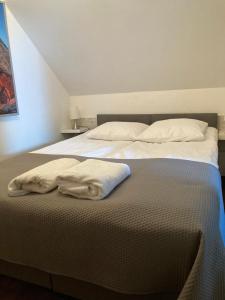 Posteľ alebo postele v izbe v ubytovaní Apartamenty i Pokoje Na Letniej