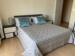 מיטה או מיטות בחדר ב-Appartamento nuovissimo e elegante