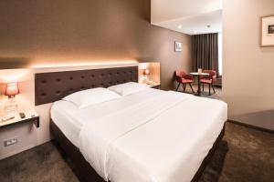 Voodi või voodid majutusasutuse Hotel Navarra Brugge toas