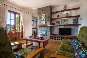 a living room with a couch and a table at Villa Markus - Plusholidays in Calpe