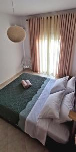 Postel nebo postele na pokoji v ubytování Giotouli Apartment