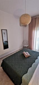 Postel nebo postele na pokoji v ubytování Giotouli Apartment