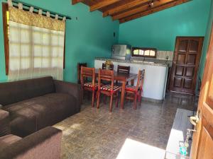 a living room with a couch and a table at RESIDENCIAL LOS ANDES in Jardín América