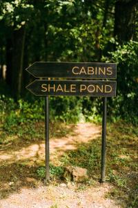 a sign for a shade pond on a trail at Gather Greene in Coxsackie