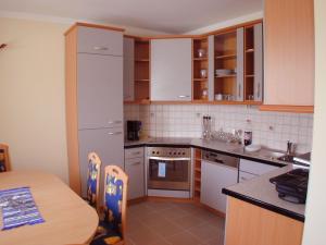 Kuchyň nebo kuchyňský kout v ubytování Ferienhaus Dorfruhe + 25 fotografií