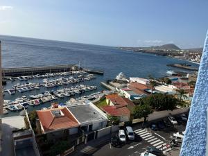 a view of a marina with boats in the water at ApartBeach Wyliana in Candelaria