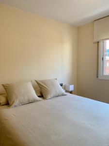 A bed or beds in a room at Atico duplex en Malgrat de Mar