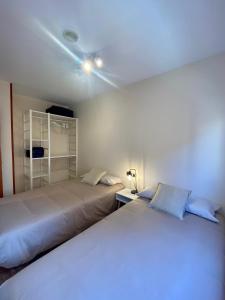 A bed or beds in a room at Atico duplex en Malgrat de Mar