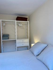 A bed or beds in a room at Atico duplex en Malgrat de Mar