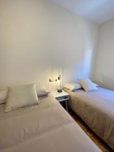 A bed or beds in a room at Atico duplex en Malgrat de Mar