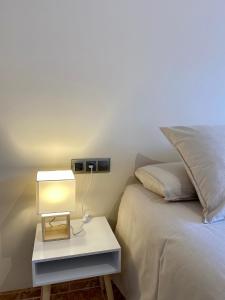 A bed or beds in a room at Atico duplex en Malgrat de Mar