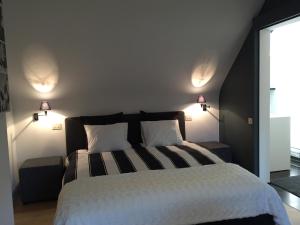 Rúm í herbergi á Guesthouse Villa Vauban