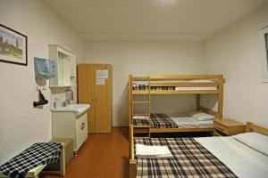 Postel nebo postele na pokoji v ubytování Hostel 42