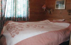 a bedroom with a large bed with red footprints on it at Pet Friendly Home In Skei I Jlster With Kitchen in Årdal