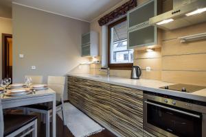 Kuchyňa alebo kuchynka v ubytovaní TatryTOP Apartamenty Kaszelewski + 37 fotografií