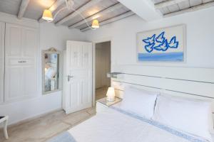 Postel nebo postele na pokoji v ubytování Mykonos Psarou Place
