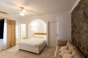 Postel nebo postele na pokoji v ubytování Mykonos Psarou Place