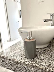 a bathroom counter with a sink and a white sink at Luxury Apartment with Great Location 2-A in Matamoros