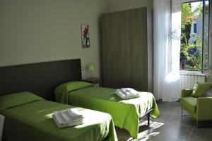 Postel nebo postele na pokoji v ubytování Il Giardinetto Guest House