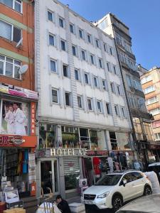 a large white building on a city street at Hotel Ay in Istanbul