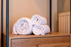 a pile of towels sitting on top of a table at Woodroffe Arms, Hope Room 3 in Hope