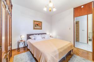 a bedroom with a large bed in a room at Apartment 123 for you in Split