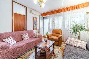 a living room with a couch and a chair at Apartment 123 for you in Split