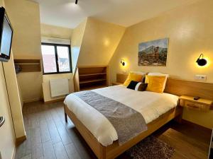 Postel nebo postele na pokoji v ubytování Les Chambres Du Vignoble