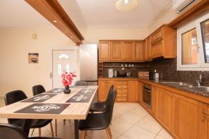 A kitchen or kitchenette at Yanna's Sea View Holiday House Close to Corfu Town