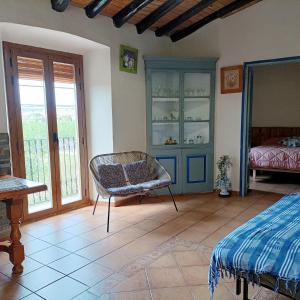 Posteľ alebo postele v izbe v ubytovaní Alojamiento Familiar con Chimenea - Alt Empordà