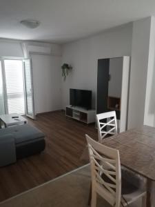 TV a/nebo společenská místnost v ubytování Apartment