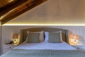 Postel nebo postele na pokoji v ubytování Hotel Pousada Kaster