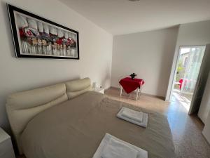 A bed or beds in a room at Casa Roma rooms& apartmens